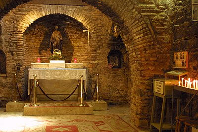House of Virgin Mary: Located on the top of the Bulbul mountain 9 km ahead of Ephesus, the shrine of Virgin Mary enjoys a marvelous atmosphere hidden in the green. It is the place where Mary may have spent her last days. Indeed, she may have come in the area together with Saint John, who spent several years in the area to spread Christianity. Mary preferred this remote place rather than living in crowded place.The house of Virgin Mary is a typical Roman architectural example, entirely made of stones. In the 4th century AD, a church, combining her house and grave, has been built. The original two-stored house, which consisted of an anteroom (where today candles are proposed), bedroom and praying room (Christian church area) and a room with fireplace (chapel for Muslims). A front kitchen fell into ruins and has been restored in 1940s. Today, only the central part and a room on the right of the altar are open to visitors. From there one can understand that this building looks more like a church than a house. Another interesting place is the Water of Mary, a source to be found at the exit of the church area and where a rather salt water, with curative properties, can be drunk by all. Paul VI was the first pope to visit this place in the 1960s. Later, in the 1980s, during his visit, Pope John-Paul II declared the Shrine of Virgin Mary has a pilgrimage place for Christians. It is also visited by Muslims who recognize Mary as the mother of one of their prophets. Every year, on August 15th a ceremony is organized to commemorate Marys Assumption 